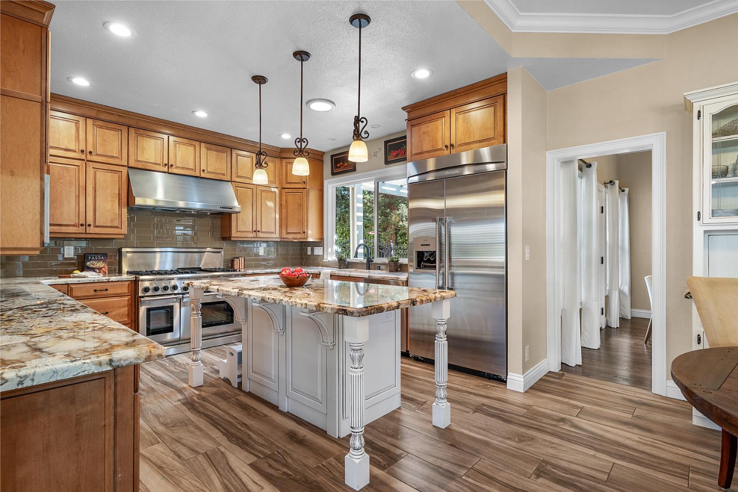 8300 Auburn Folsom Road Granite Bay, CA 95746 - Photo 5 of 45 a kitchen with a stove and a refrigerator