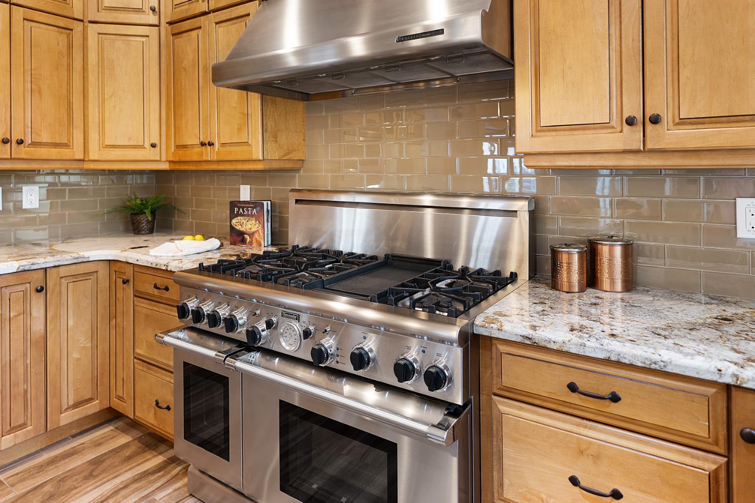 8300 Auburn Folsom Road Granite Bay, CA 95746 - Photo 6 of 45 a stove top oven sitting inside of a kitchen