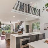 a kitchen with a stove and a white cabinets