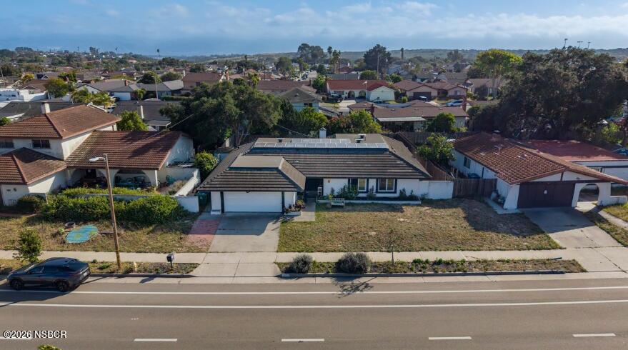 4220 Constellation Road Lompoc, CA 93436 - Photo 1 of 22 an aerial view of a house with a garden and parking space