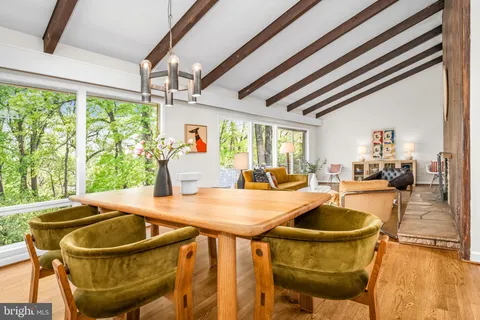 a kitchen with a table and chairs