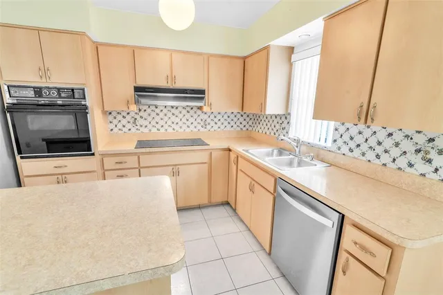 a living room with furniture fireplace and window