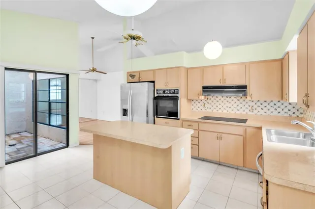 a view of room with window and ceiling fan