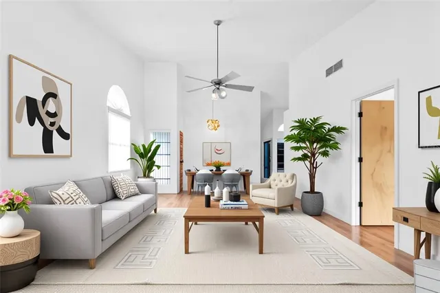 a view of an empty room with a fireplace and a window