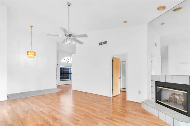a kitchen with a sink a refrigerator and cabinets