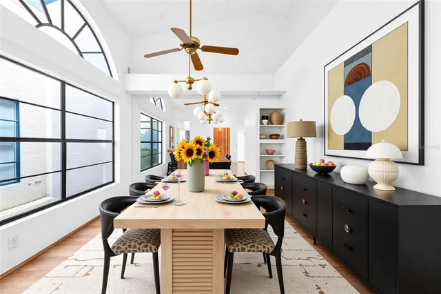 a kitchen with granite countertop a refrigerator and a stove top oven