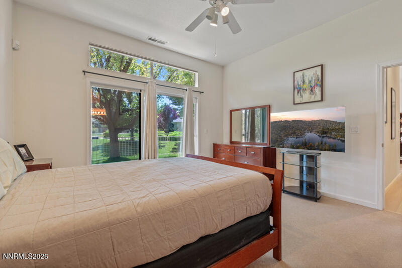 403 Sierra Leaf Circle Reno, NV 89511 - Photo 14 of 25 a bedroom with a bed table and window