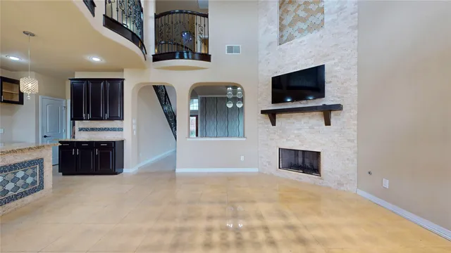 a view of kitchen with stainless steel appliances wooden floor and window
