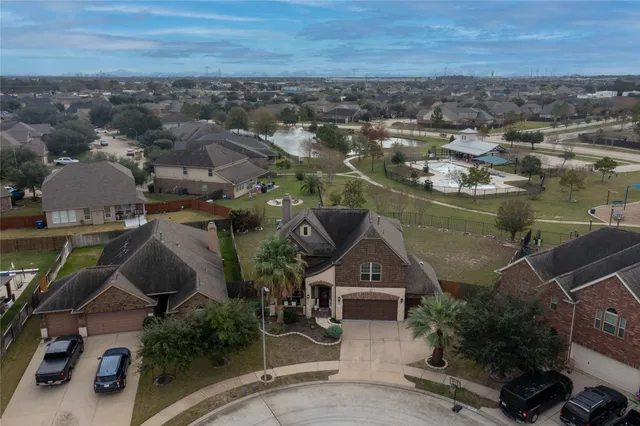 an aerial view of a house with a lake view