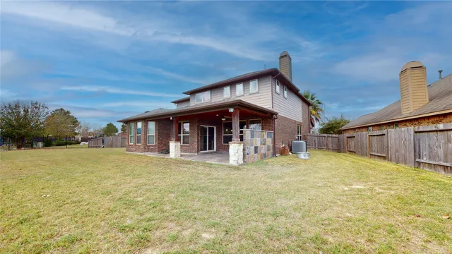 a front view of a house with swimming pool having outdoor seating