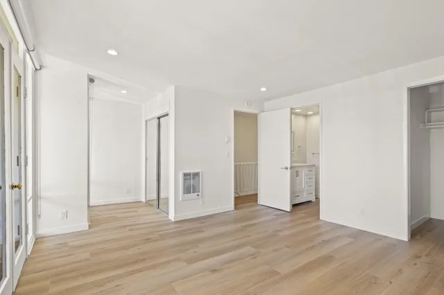 a view of a livingroom with wooden floor