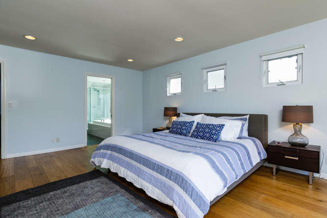 1330 Beachmont Street Ventura, CA 93001 - Photo 18 of 35 a bedroom with a bed and a night stand