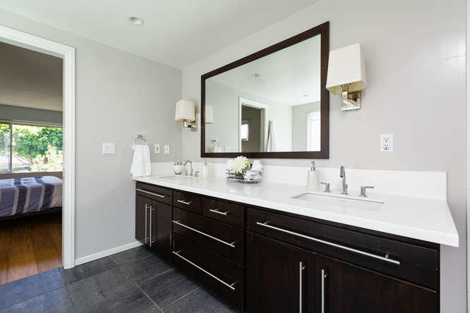 1330 Beachmont Street Ventura, CA 93001 - Photo 20 of 35 a bathroom with a double vanity sink and a mirror