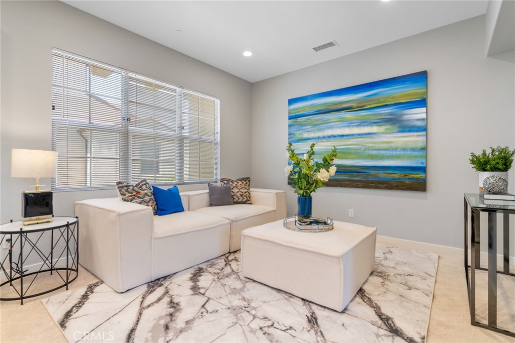 133 Tubeflower Irvine, CA 92618 - Photo 1 of 1 a living room with furniture and a potted plant
