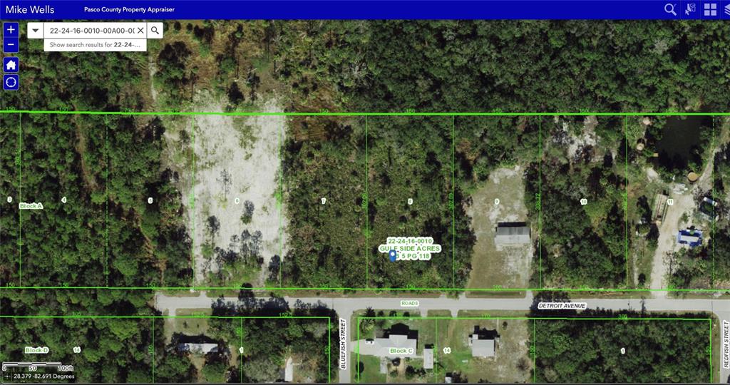 8 Detroit Avenue Hudson, FL 34667 - Photo 4 of 4 a view of a with a red gate