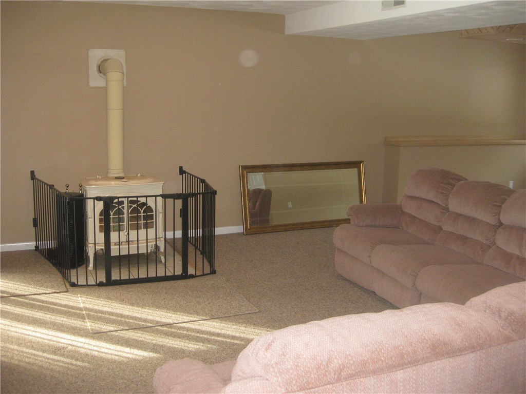 752 Hammet Road Coventry, RI 02816 - Photo 16 of 22 wood stove in lower family room