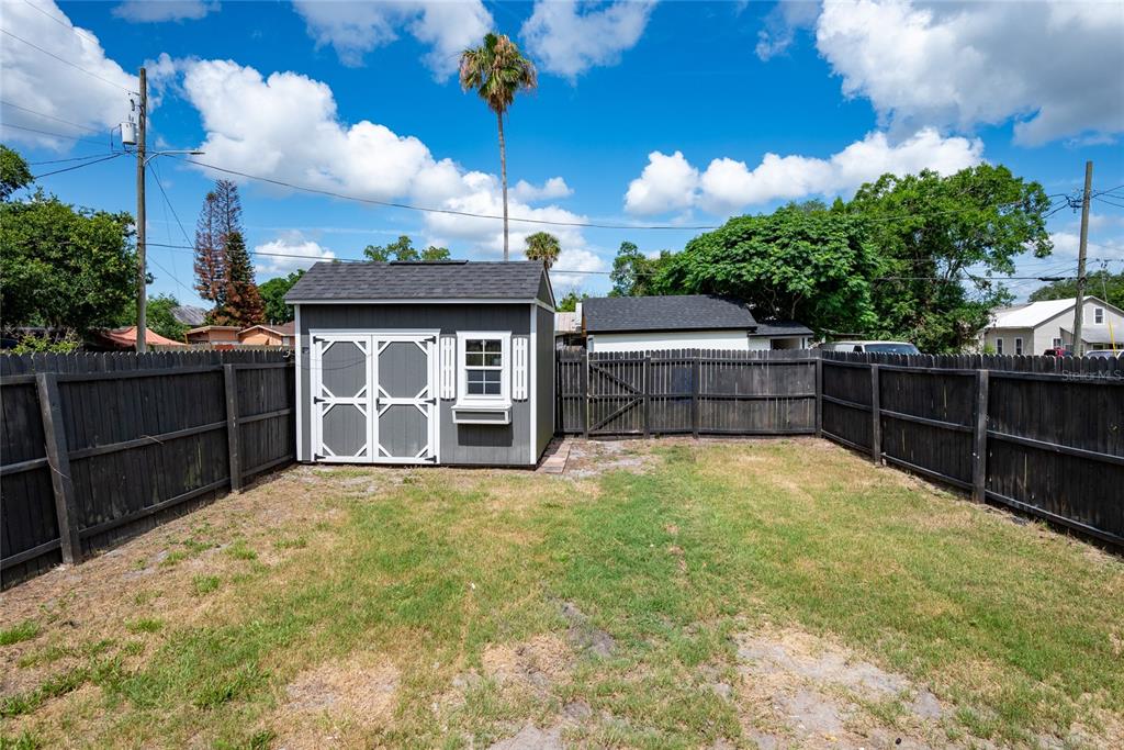 922 Delaware Avenue St. Cloud, FL 34769 - Photo 3 of 31 a view of a backyard with furniture