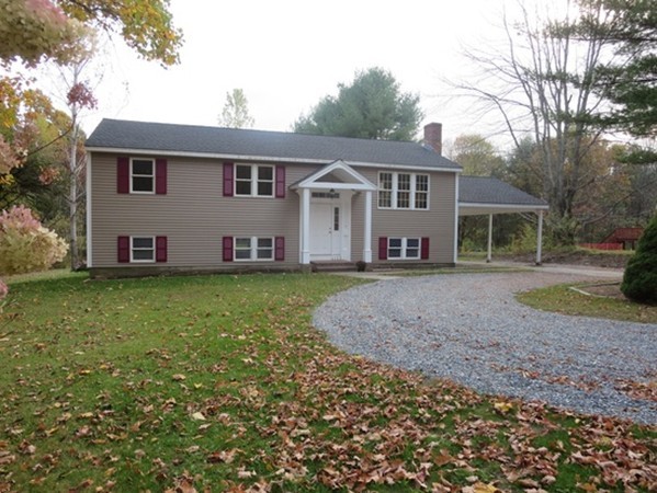 112 West Groton Road Shirley, MA 01464 - Photo 1 of 29 a front view of a house with a garden