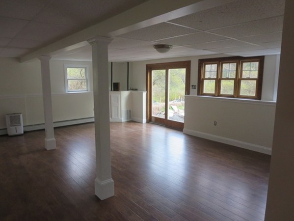 112 West Groton Road Shirley, MA 01464 - Photo 17 of 29 a view of an empty room with wooden floor and a window