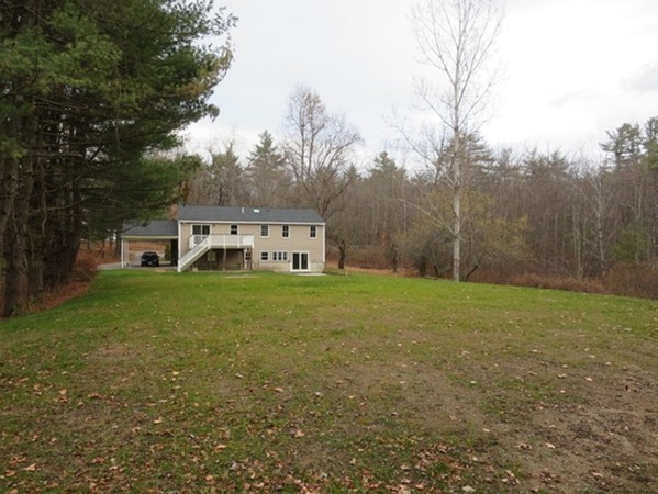 112 West Groton Road Shirley, MA 01464 - Photo 28 of 29 a yellow house in middle of the forest