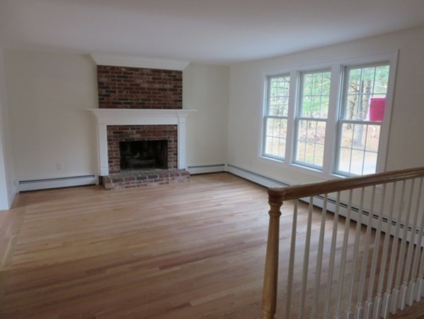 112 West Groton Road Shirley, MA 01464 - Photo 7 of 29 a view of an empty room with wooden floor fireplace and a window