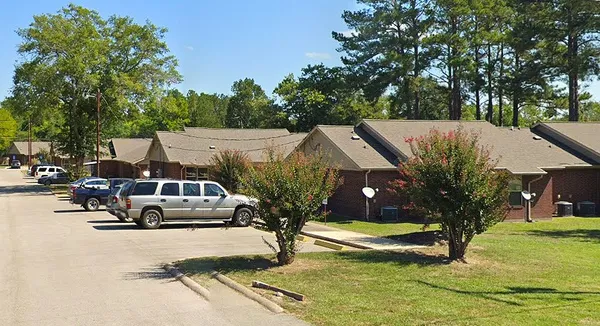 a view of multiple houses with yard