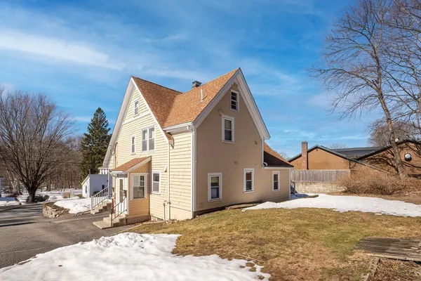 a view of house with yard