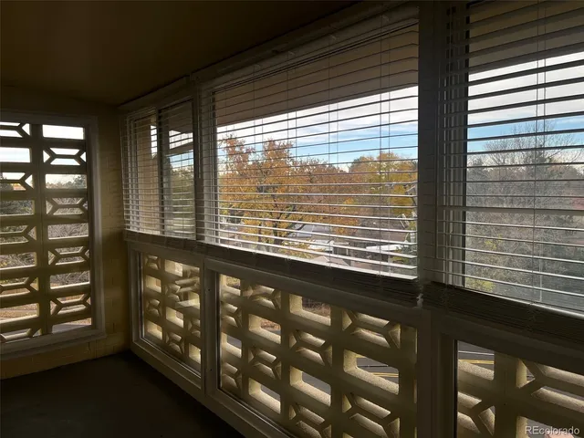 a view of an empty room with windows
