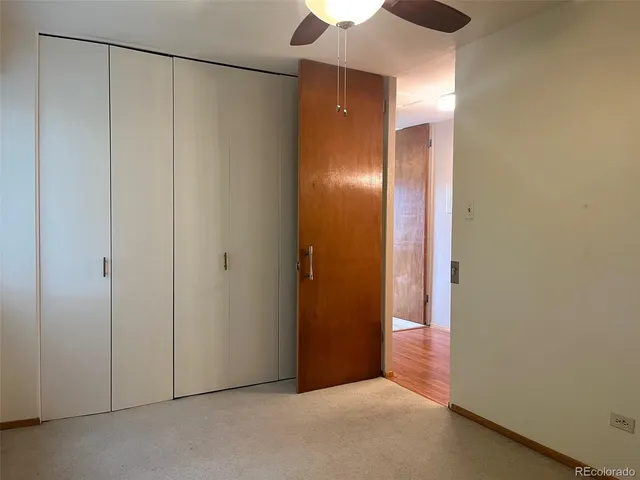 a view of an empty room with a bathroom