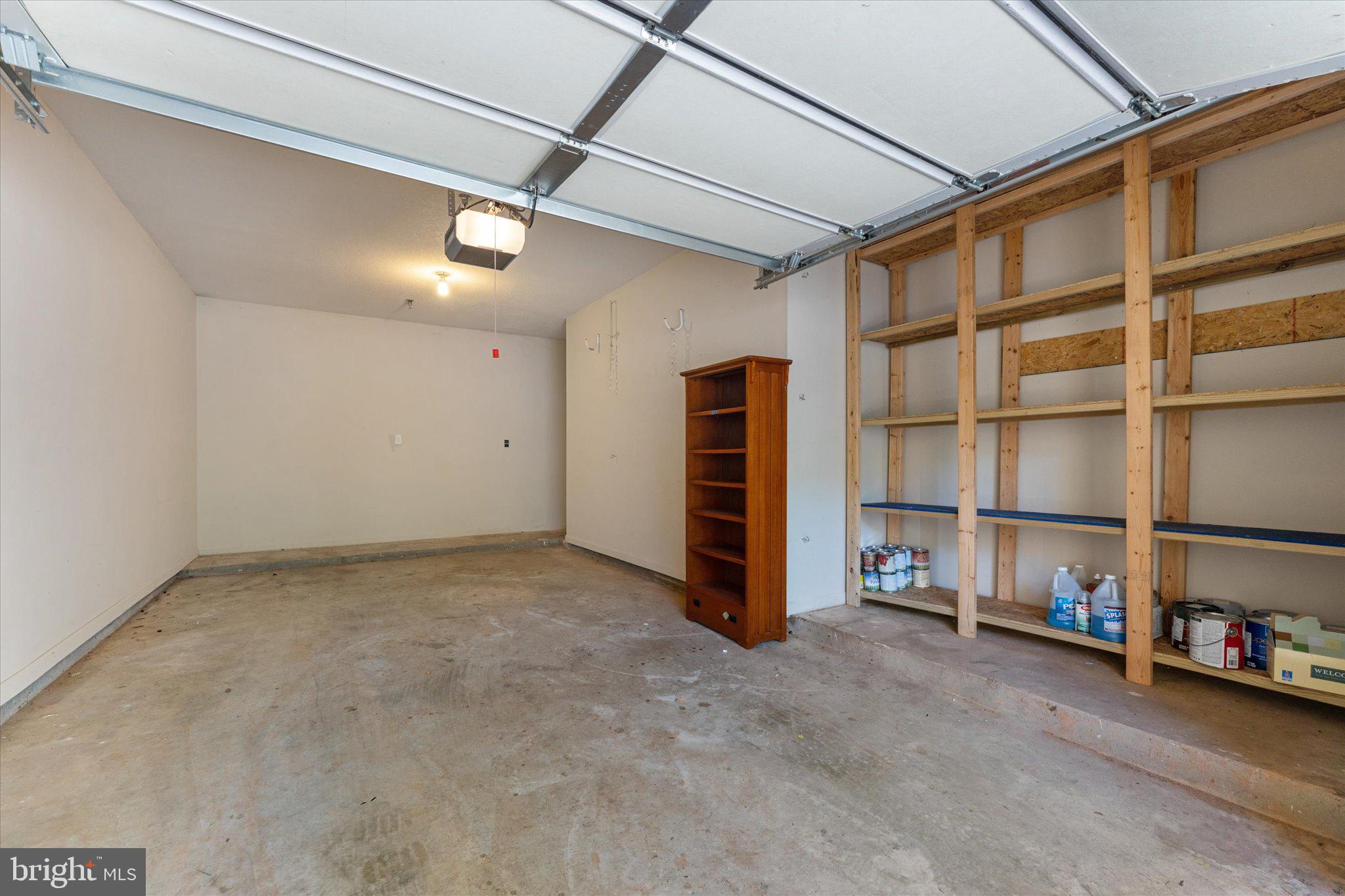 503 Sunset View Terrace Southeast, Unit 101 Leesburg, VA 20175 - Photo 32 of 39 Spacious garage with ample storage.