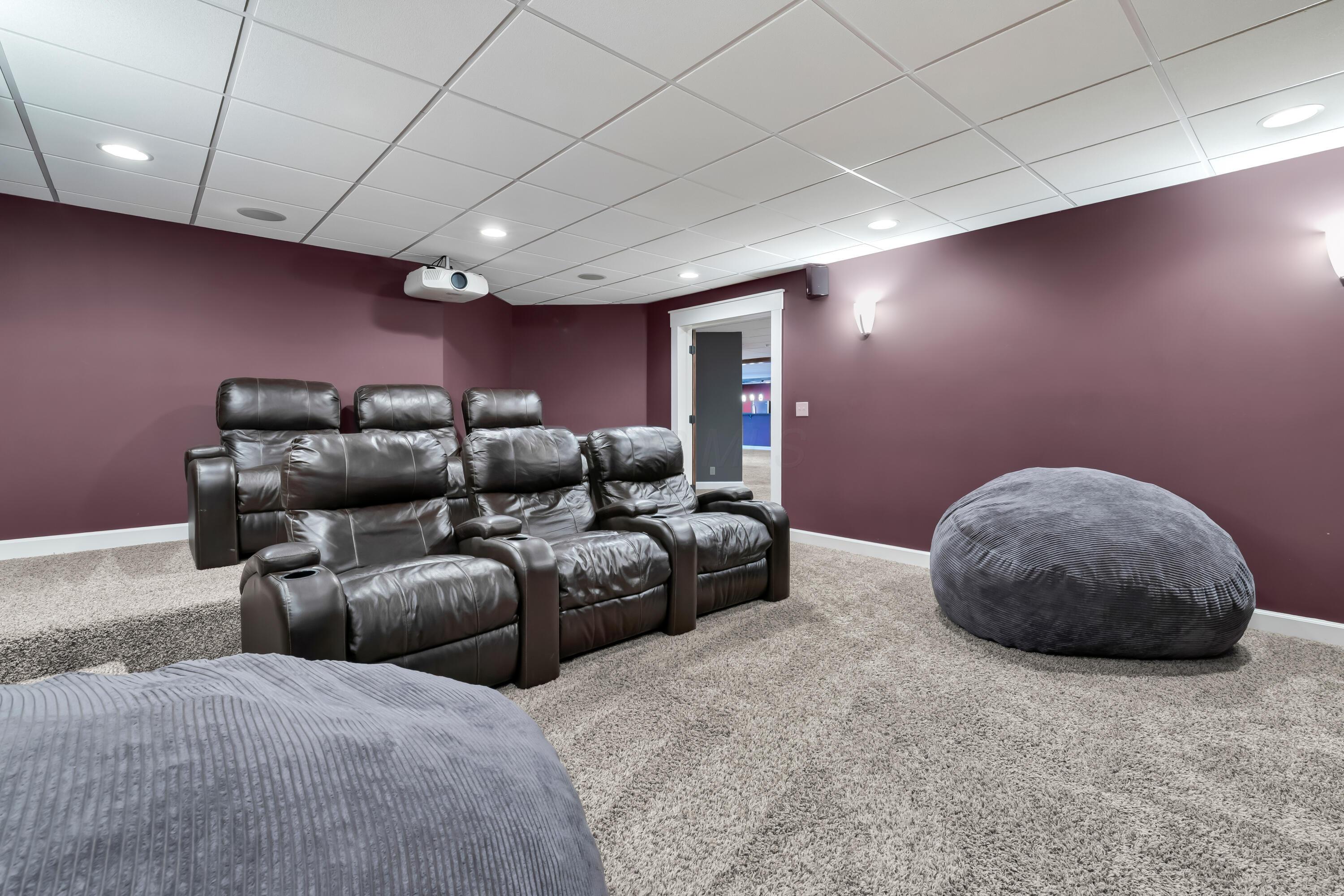 16689 Bailor Road Laurelville, OH 43135 - Photo 43 of 73 • Light sand carpet
• Plum painted walls
• Platform with seating
• Acoustic ceiling tiles
• Seating is negotiable
• Projector & screen remains
• Built-in entertainment unit
• TV is negotiable
• Mount remains
• Lighted wall sconces
• Speakers are negotiable