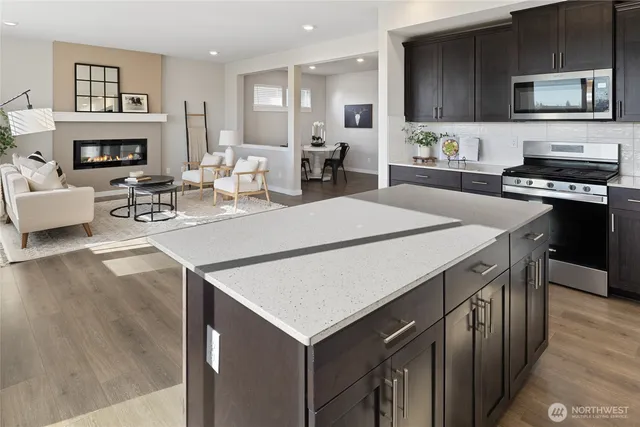 a kitchen with a stove a sink and a refrigerator