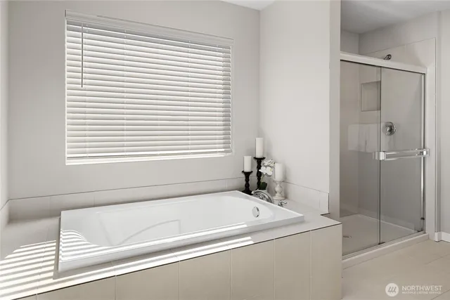 a bath tub sitting next to a window