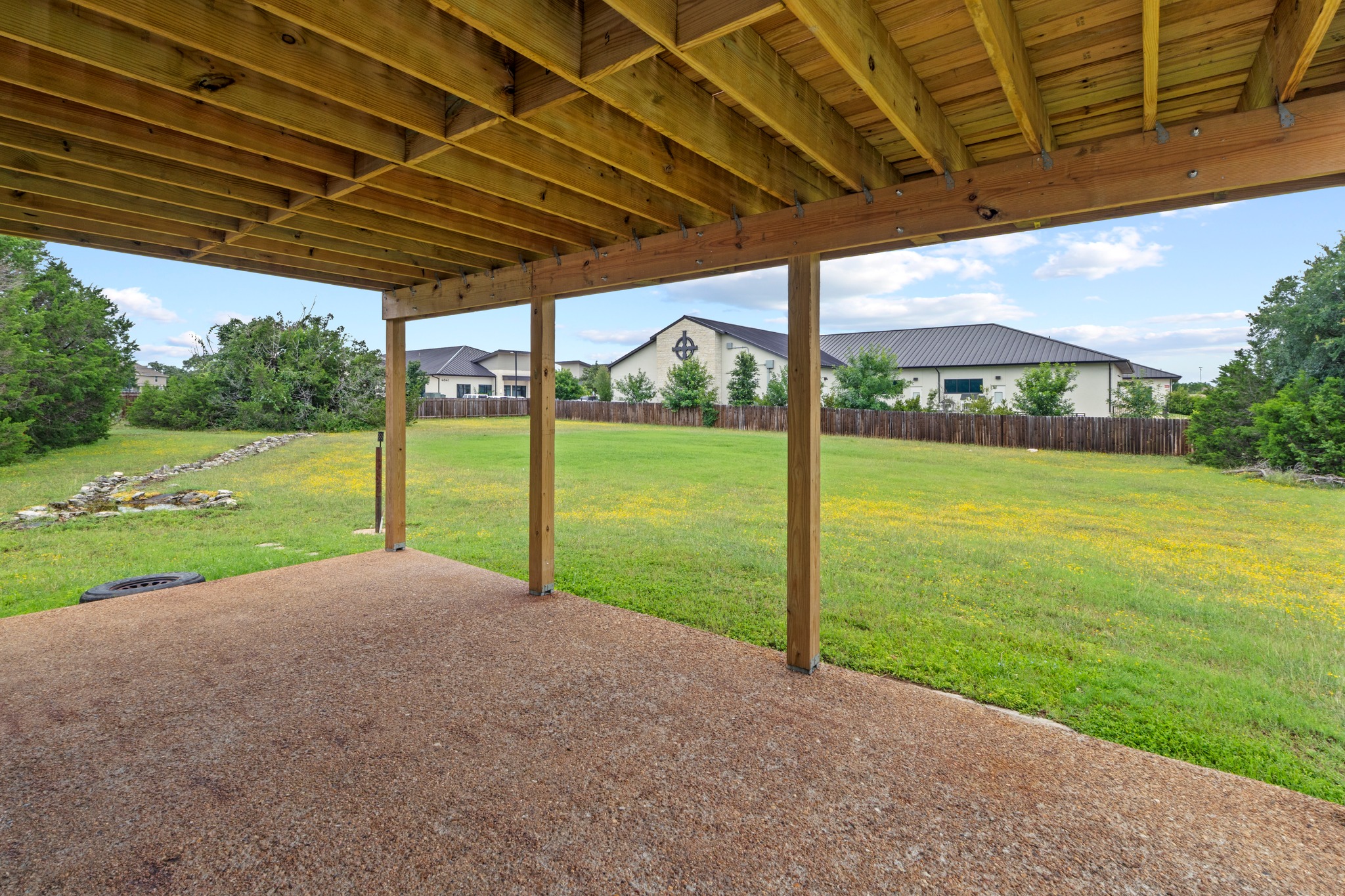 205 Sedro Trail Georgetown, TX 78633 - Photo 5 of 32 A spacious covered patio overlooks a generous, fenced yard with open green space.