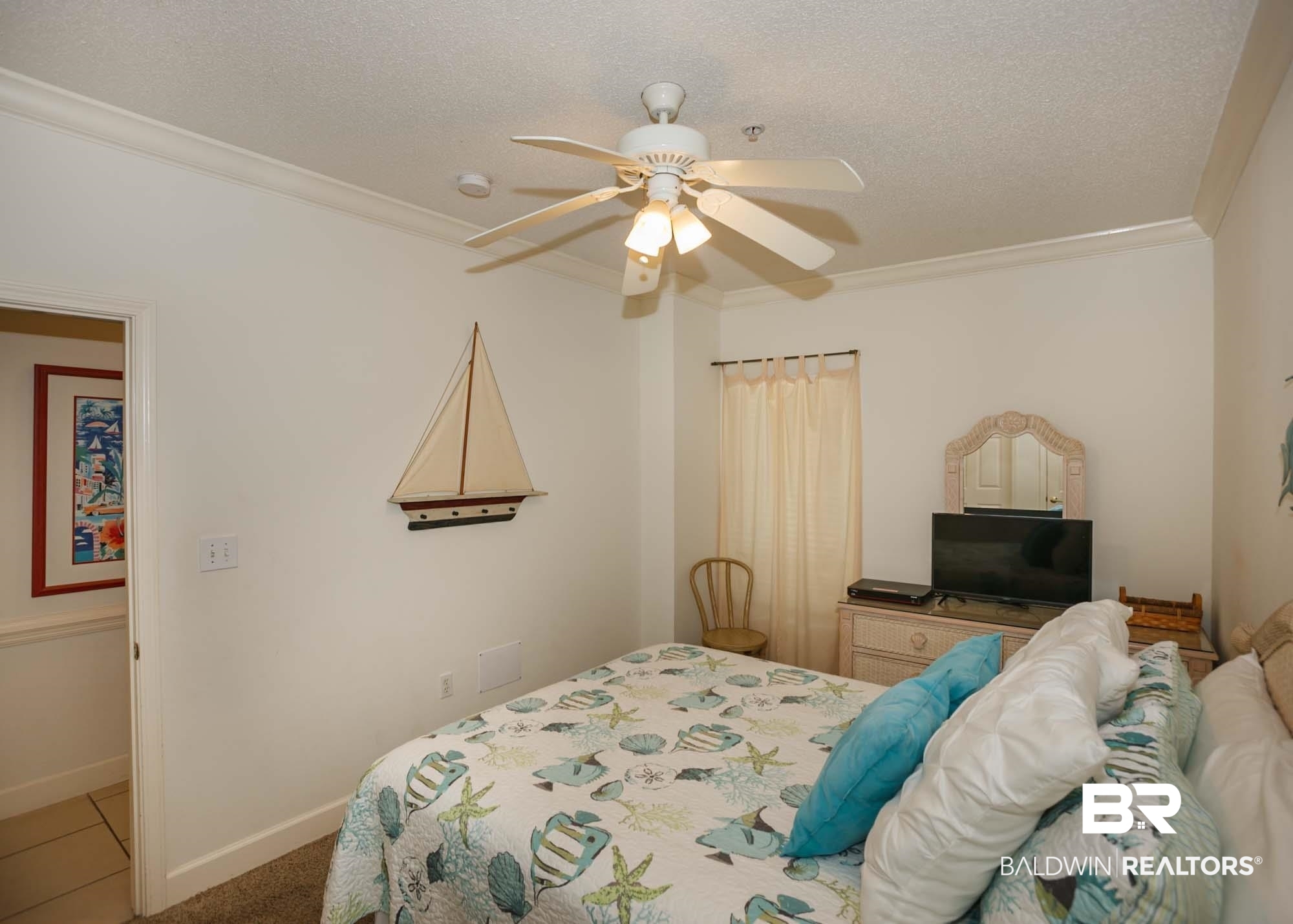 28910 Perdido Beach Boulevard, Unit 4B Orange Beach, AL 36561 - Photo 28 of 48 Bedroom featuring a textured ceiling, ornamental molding, baseboards, and a ceiling fan