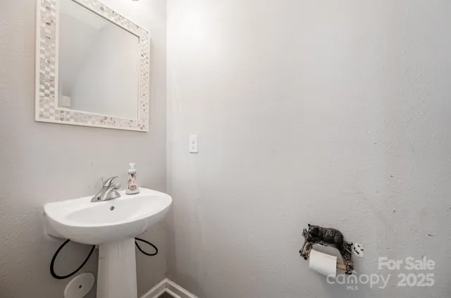 a bathroom with a sink and mirror