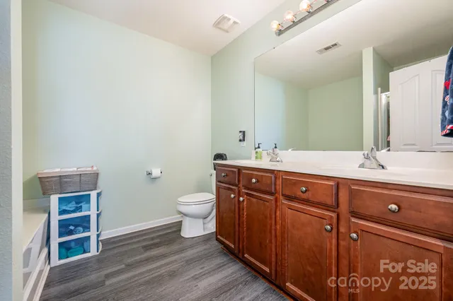 a spacious bathroom with a sink and a toilet