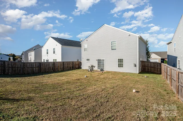 a view of a backyard of the house