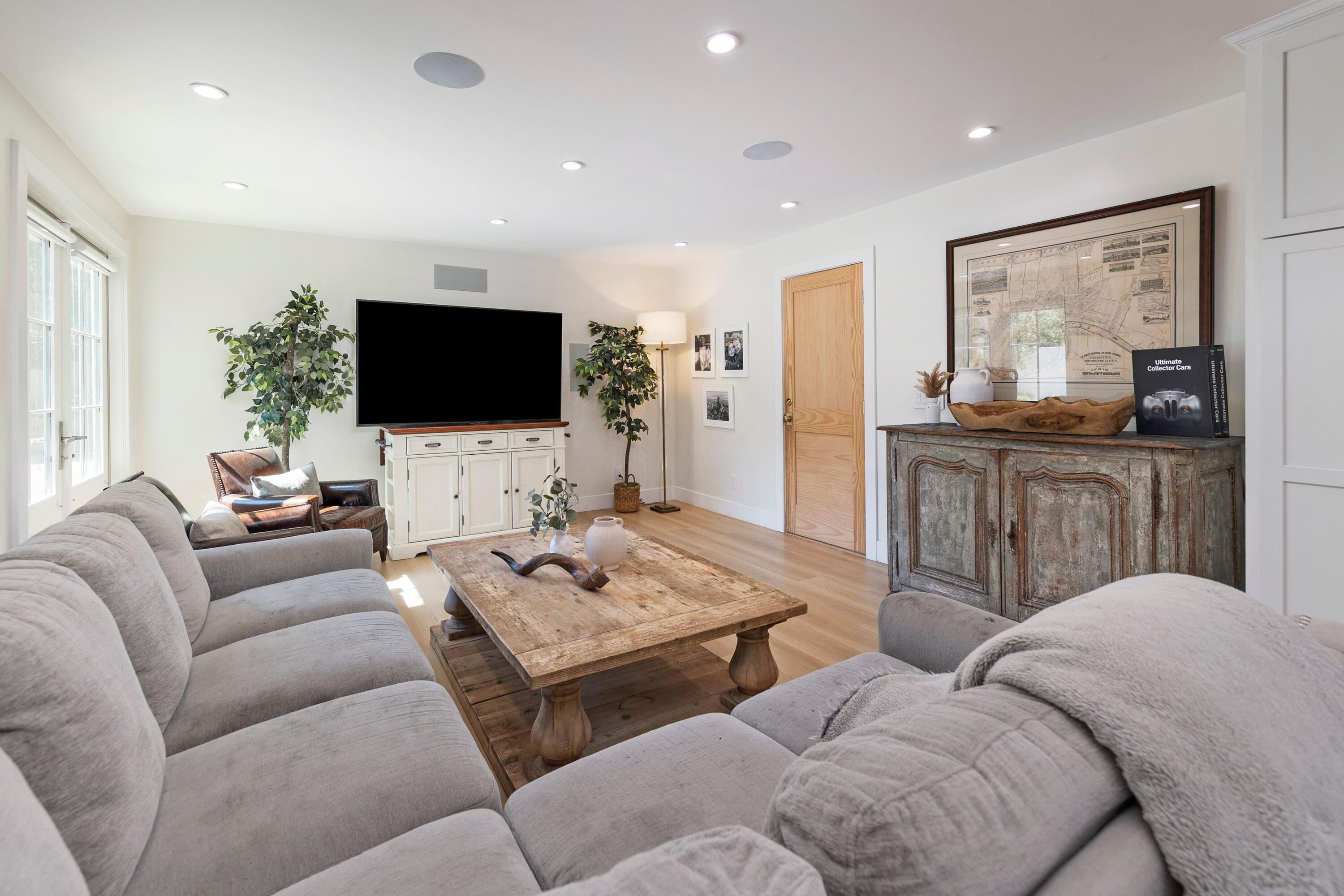 487 Hot Springs Road Santa Barbara, CA 93108 - Photo 9 of 47 a living room with furniture and a flat screen tv