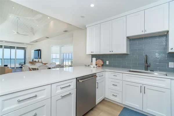a kitchen with white cabinets