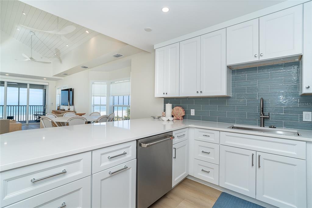 7524 Palm Island Drive South, Unit 1322 Boca Grande, FL 33921 - Photo 11 of 53 a kitchen with white cabinets