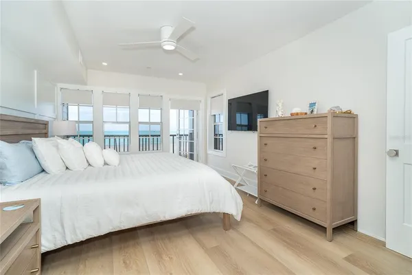 a bed room with a bed and a television