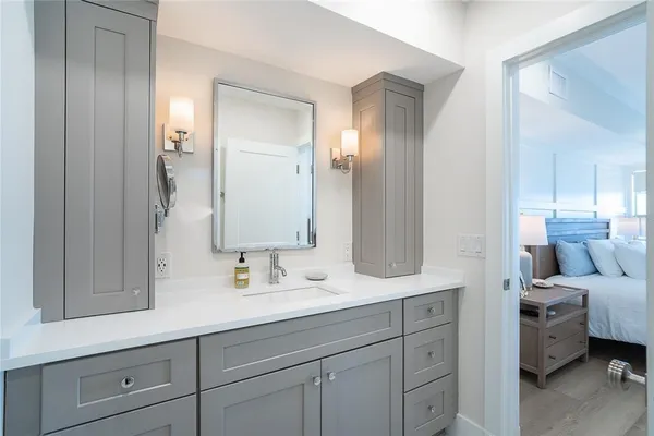 a en suite bathroom with double sink and a mirror