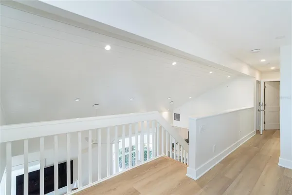 a bedroom with a bed and a table