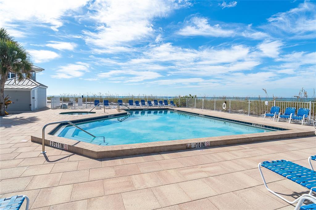 7524 Palm Island Drive South, Unit 1322 Boca Grande, FL 33921 - Photo 46 of 53 a view of a swimming pool with an outdoor seating
