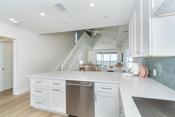 a kitchen with sink a cabinets and window