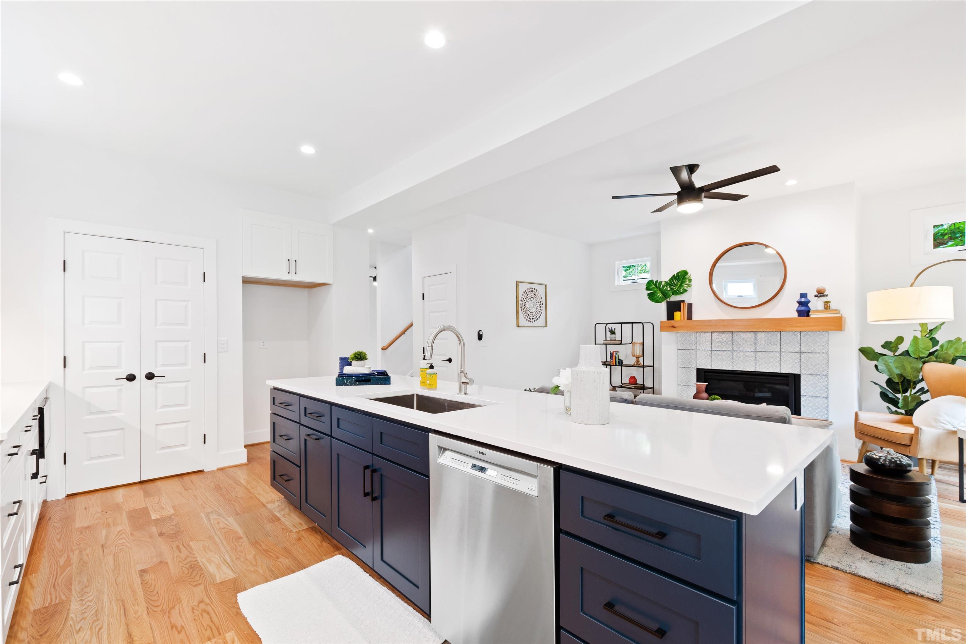 704 Colonial Street Durham, NC 27701 - Photo 15 of 42 a kitchen with a sink cabinets and wooden floor