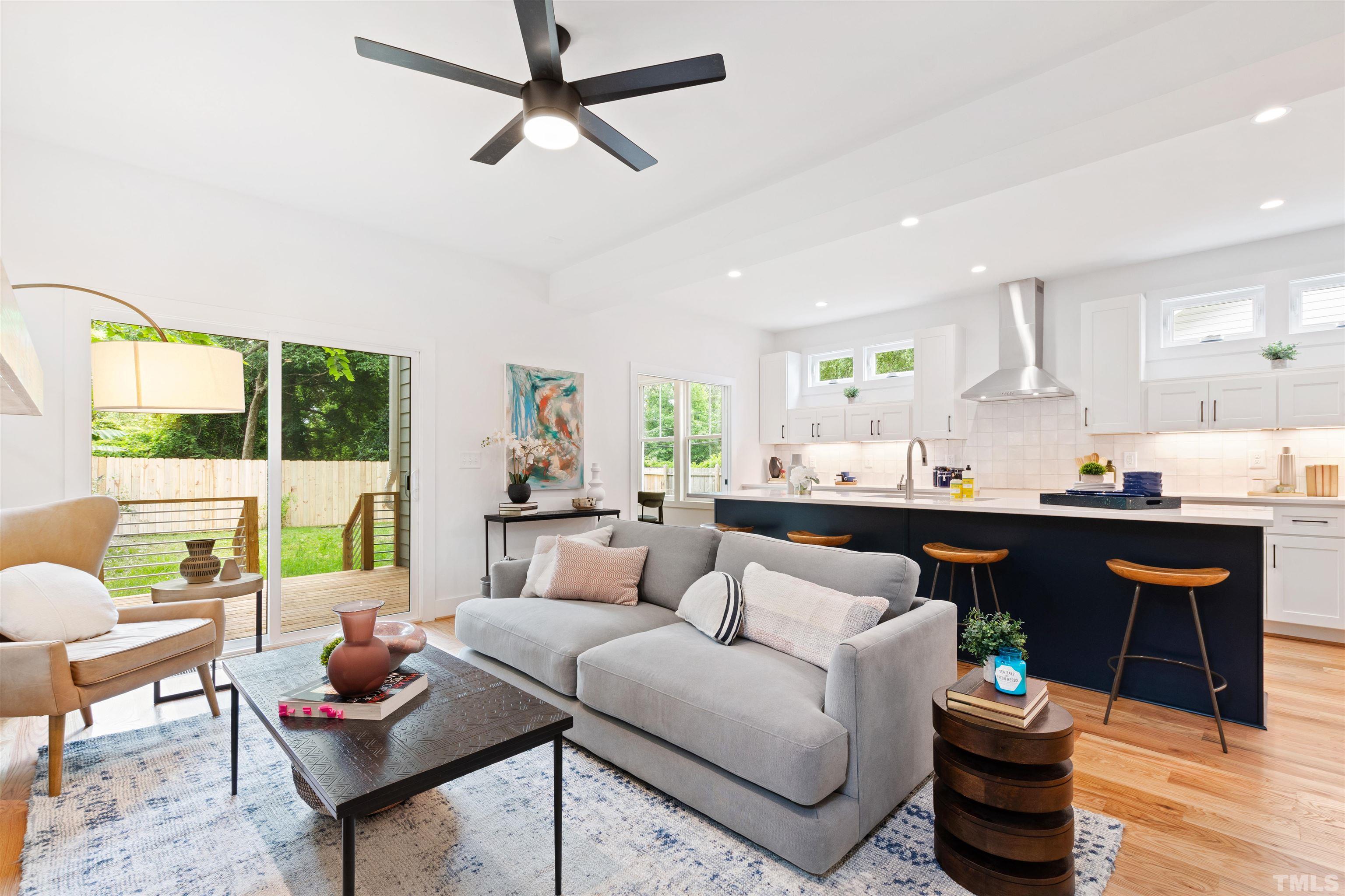 704 Colonial Street Durham, NC 27701 - Photo 19 of 42 a living room with furniture and a large window