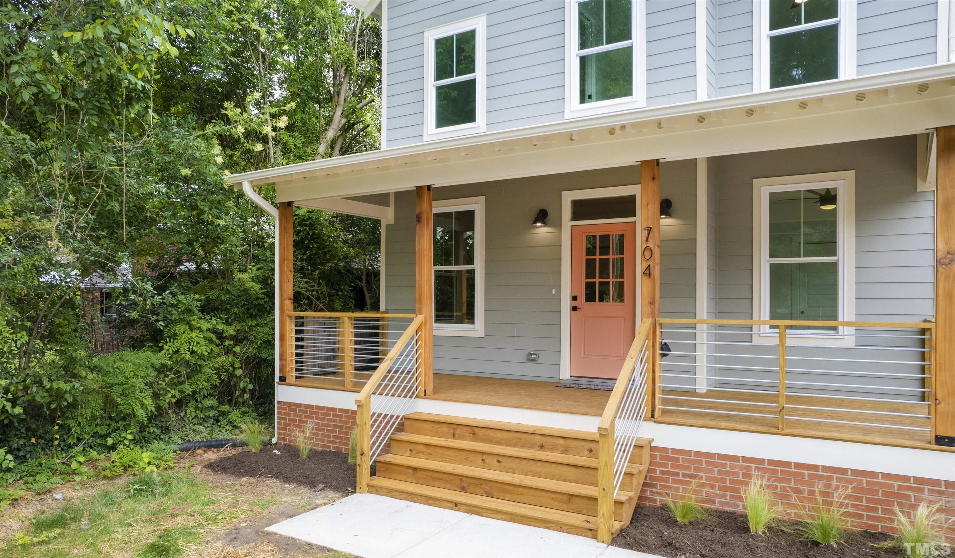 704 Colonial Street Durham, NC 27701 - Photo 2 of 42 a front view of a house with a yard