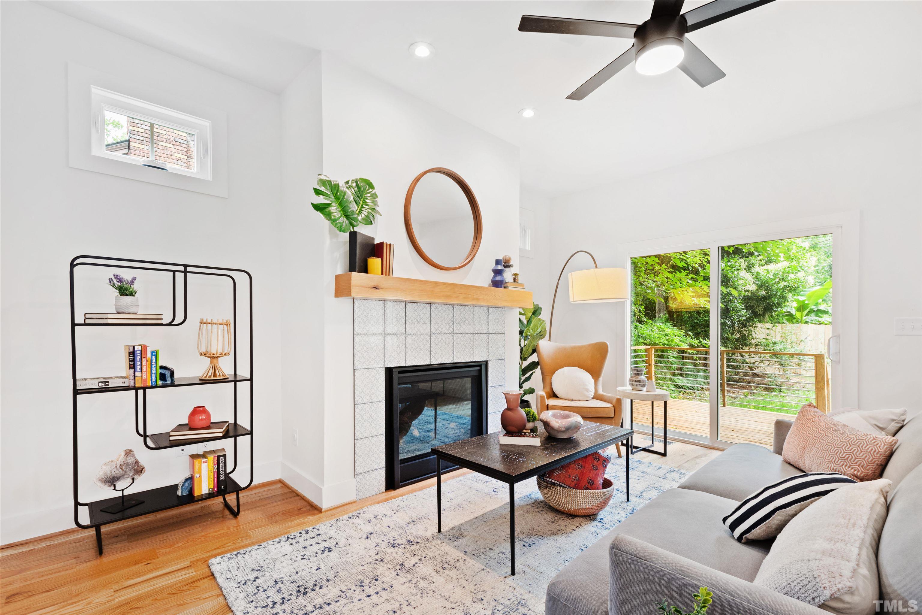 704 Colonial Street Durham, NC 27701 - Photo 21 of 42 a living room with furniture and a fireplace